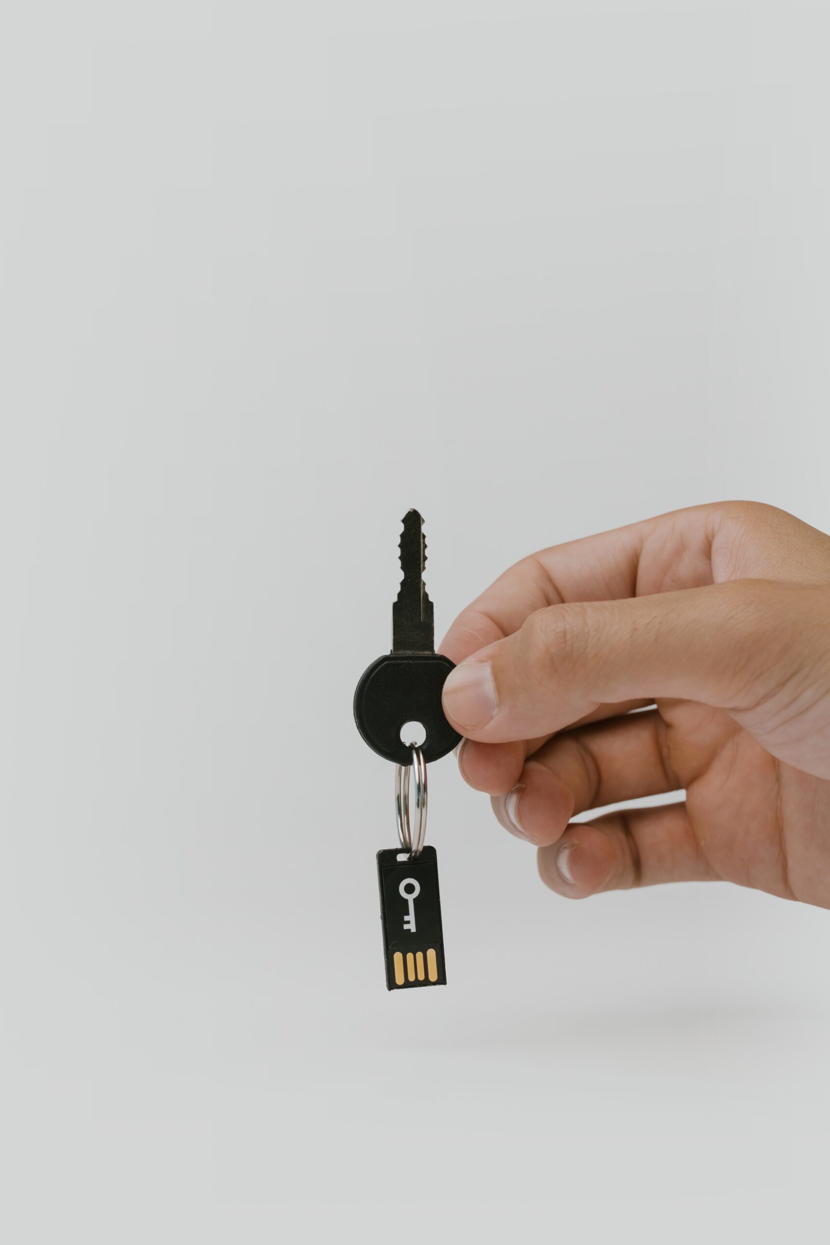 pexels-cottonbro-5474298 A keychain with a security key attached.